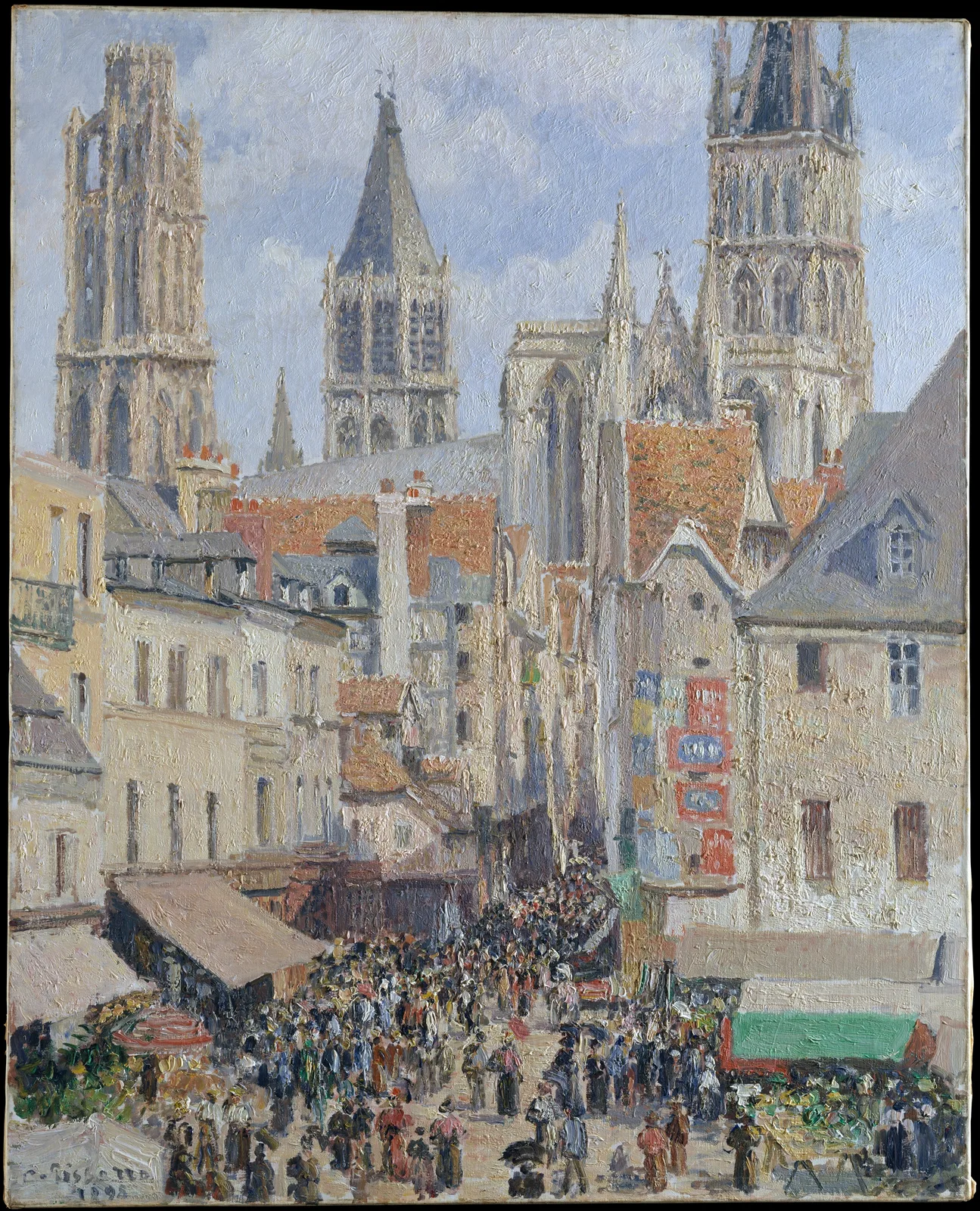 Camille Pissarro, Rue de l'Epicerie, Rouen (Effect of Sunlight): in a tall picture, the Gothic towers of Rouen Cathedral rise against a blue sky. Below, cream and grey houses line a narrow street, with red and blue signs on the right-hand wall. The lower part is filled with a market crowd packed between awninged stalls.