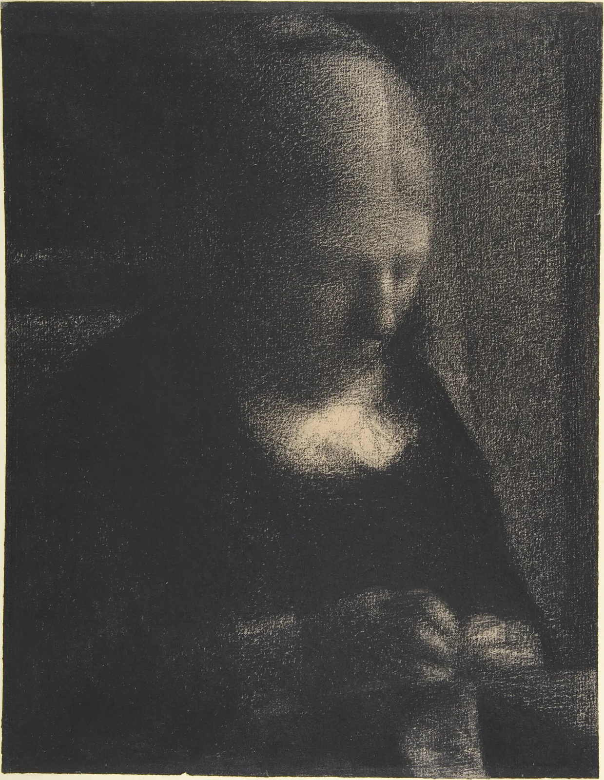 Seurat's conté crayon drawing Embroidery; The Artist's Mother. In the middle of an almost black sheet, the top of a woman's bowed head catches light from the upper right in a bright arc, and the ridge of her nose and the white collar under her chin glow. The left half of her head dissolves into the dark background with no visible boundary. At lower right, her sewing hands appear as a few faint grey strokes. The grain of the paper shows through the whole sheet as white specks.