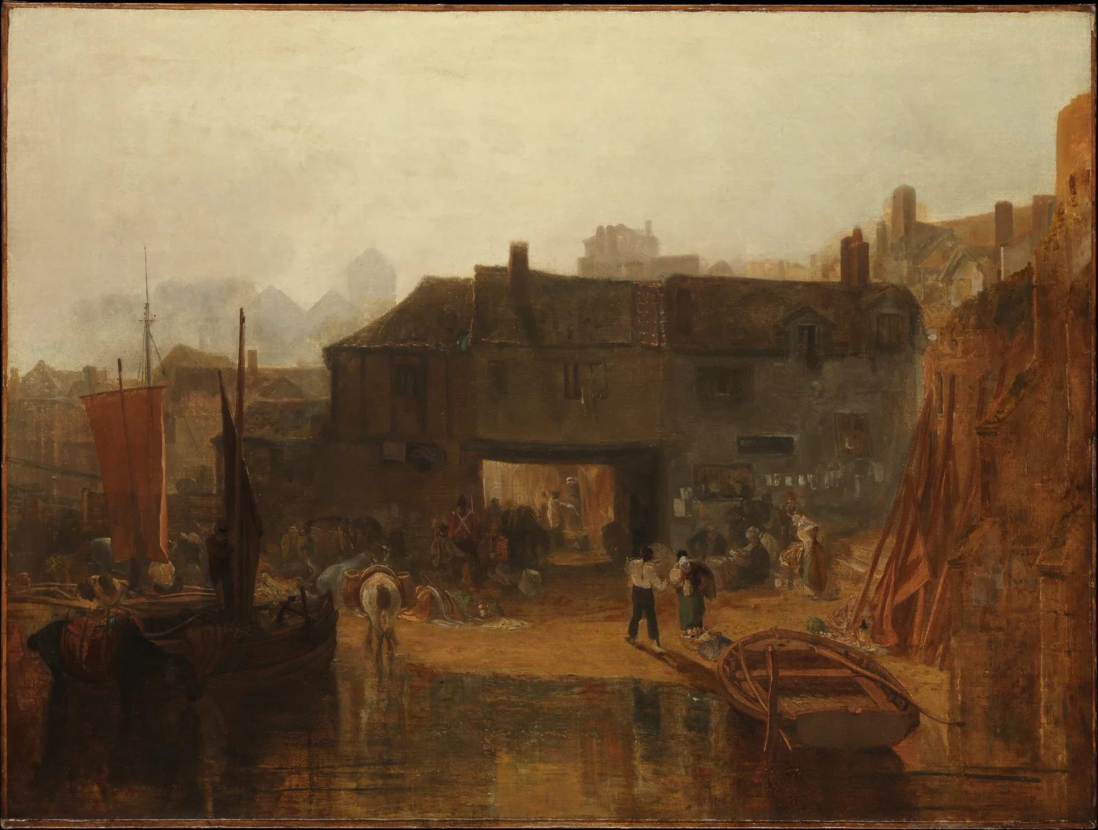 Turner, Saltash with the Water Ferry, Cornwall: an old dark building with an arched passage runs across the middle of the picture, and only the inside of the arch is bright. On the yellowish muddy shore in front, a man in a white shirt carrying a load stands with his back to us, and beside him a woman in a headscarf bends over next to a basket. On the left are a boat with a red sail and a white packhorse; at lower right an empty ferry boat floats on the water. The sky is a dull yellowish haze.
